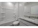 Bathroom featuring a shower-tub combo, granite countertop vanity, and white fixtures at 40000 W Bravo Dr, Maricopa, AZ 85138