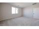 Carpeted bedroom featuring a window that provides natural light at 40000 W Bravo Dr, Maricopa, AZ 85138
