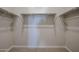 Walk in closet with rods for organized storage at 40000 W Bravo Dr, Maricopa, AZ 85138
