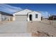 Charming single-story home featuring a neutral color palette and a two-car garage at 40000 W Bravo Dr, Maricopa, AZ 85138