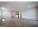 Spacious living room showcasing recessed lighting and tile floors with an open floor plan at 40000 W Bravo Dr, Maricopa, AZ 85138