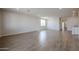 Spacious living room featuring tile floors, recessed lighting, and neutral paint at 40000 W Bravo Dr, Maricopa, AZ 85138