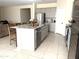 Modern kitchen with granite countertops and stainless steel appliances at 24569 W Whyman Ave, Buckeye, AZ 85326