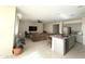 Open concept kitchen with island and granite countertops at 24569 W Whyman Ave, Buckeye, AZ 85326