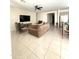 Spacious living room featuring comfortable seating and a large TV at 24569 W Whyman Ave, Buckeye, AZ 85326