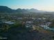 Expansive aerial view showcasing the property, surrounding landscape, and distant mountains at 2626 E Arizona Biltmore Cir # 40, Phoenix, AZ 85016