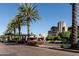 Beautifully landscaped entrance with palm trees and colorful flowers leading to the building at 2626 E Arizona Biltmore Cir # 40, Phoenix, AZ 85016