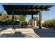 Relaxing outdoor seating area with a shaded pergola, perfect for dining and entertaining at 2626 E Arizona Biltmore Cir # 40, Phoenix, AZ 85016