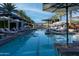 Refreshing swimming pool with lounge chairs and umbrellas, ideal for relaxation and recreation at 2626 E Arizona Biltmore Cir # 40, Phoenix, AZ 85016