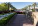 Scenic walkway lined with lush greenery and vibrant flowerbeds, enhancing the landscape at 2626 E Arizona Biltmore Cir # 40, Phoenix, AZ 85016