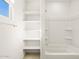 Bathroom with shelves, shower/tub, and linen shelves at 4033 S 177Th Ave, Goodyear, AZ 85338