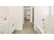 Double vanity bathroom with soaking tub and walk-in closet at 4033 S 177Th Ave, Goodyear, AZ 85338