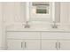 Double vanity bathroom with quartz countertops and modern faucets at 4033 S 177Th Ave, Goodyear, AZ 85338