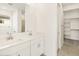 Double vanity bathroom with walk-in closet access at 4033 S 177Th Ave, Goodyear, AZ 85338
