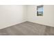 Spacious bedroom with neutral carpeting and a window with blinds at 4033 S 177Th Ave, Goodyear, AZ 85338