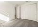 Bedroom with carpet, door to hallway, and closet at 4033 S 177Th Ave, Goodyear, AZ 85338