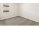 Well-lit bedroom featuring carpet and a window at 4033 S 177Th Ave, Goodyear, AZ 85338