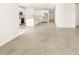 Open concept dining area with tile flooring and kitchen view at 4033 S 177Th Ave, Goodyear, AZ 85338