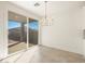 Bright dining area with sliding door access to backyard patio at 4033 S 177Th Ave, Goodyear, AZ 85338