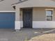 Gray front door entry to a new construction home at 4033 S 177Th Ave, Goodyear, AZ 85338
