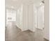 Clean hallway with tile flooring leading to other rooms at 4033 S 177Th Ave, Goodyear, AZ 85338