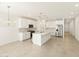 Modern kitchen with white cabinets, stainless steel appliances, and an island at 4033 S 177Th Ave, Goodyear, AZ 85338