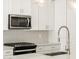 Modern kitchen with a stainless steel range and gooseneck faucet at 4033 S 177Th Ave, Goodyear, AZ 85338