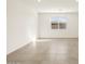 Sunlit living room featuring tile floors and a large window at 4033 S 177Th Ave, Goodyear, AZ 85338
