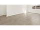 Living area with neutral colored tile floor and large windows at 4033 S 177Th Ave, Goodyear, AZ 85338