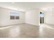 Living room with tile flooring, large window, and sliding door at 4033 S 177Th Ave, Goodyear, AZ 85338