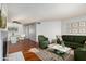 Bright living room with hardwood floors, stylish furniture, and a dining area at 11640 N 51St Ave # 250, Glendale, AZ 85304