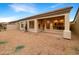 Covered patio overlooks a spacious backyard with desert landscaping at 15732 E Yucca Dr, Fountain Hills, AZ 85268