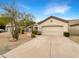 Attractive desert landscape front exterior with driveway and two-car garage at 15732 E Yucca Dr, Fountain Hills, AZ 85268