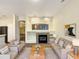 Spacious living room featuring a fireplace and ample natural light at 15732 E Yucca Dr, Fountain Hills, AZ 85268