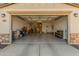 Two-car garage with epoxy flooring and storage at 17243 W Seldon Ln, Waddell, AZ 85355