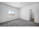 Neutral bedroom featuring a window and access to an ensuite bathroom at 24604 W St Anne Ave, Buckeye, AZ 85326