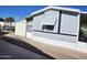 Side view of gray mobile home with storage shed at 394 N Pinyon Dr, Apache Junction, AZ 85120
