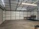 Bright and airy garage with built-in workspace and overhead lighting at 394 N Pinyon Dr, Apache Junction, AZ 85120