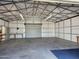 Spacious garage interior offering ample storage and workbench at 394 N Pinyon Dr, Apache Junction, AZ 85120