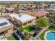 Aerial view of home featuring covered patio, manicured yard, pool, and desert landscaping at 923 W Crooked Stick Dr, Casa Grande, AZ 85122