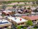 A high-angle view showcasing the rear of a home, its adjacent property, and a recreational vehicle parked nearby at 923 W Crooked Stick Dr, Casa Grande, AZ 85122