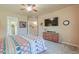 Comfortable bedroom featuring a ceiling fan, a TV, and a closet at 923 W Crooked Stick Dr, Casa Grande, AZ 85122
