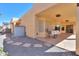 Covered patio area with gravel, stone pavers, and outdoor dining set at 923 W Crooked Stick Dr, Casa Grande, AZ 85122