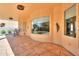 Expansive covered patio with large window for outdoor entertaining and relaxation space at 923 W Crooked Stick Dr, Casa Grande, AZ 85122