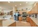 Bright kitchen featuring stainless steel appliances, tile floors, and light wood cabinetry at 923 W Crooked Stick Dr, Casa Grande, AZ 85122