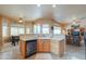 Functional kitchen island with integrated dishwasher and open views to the dining and living areas at 923 W Crooked Stick Dr, Casa Grande, AZ 85122