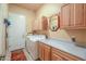 Functional laundry room with washer, dryer, storage cabinets, and a utility sink at 923 W Crooked Stick Dr, Casa Grande, AZ 85122