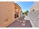 View of the side yard featuring a stone paver pathway and storage shed at 923 W Crooked Stick Dr, Casa Grande, AZ 85122