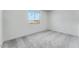 Bedroom featuring gray carpet, a window with a view, and white walls at 3804 S Buttercup --, Mesa, AZ 85212