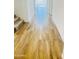 Hallway with wood-look tile and natural light that leads to other rooms at 3804 S Buttercup --, Mesa, AZ 85212